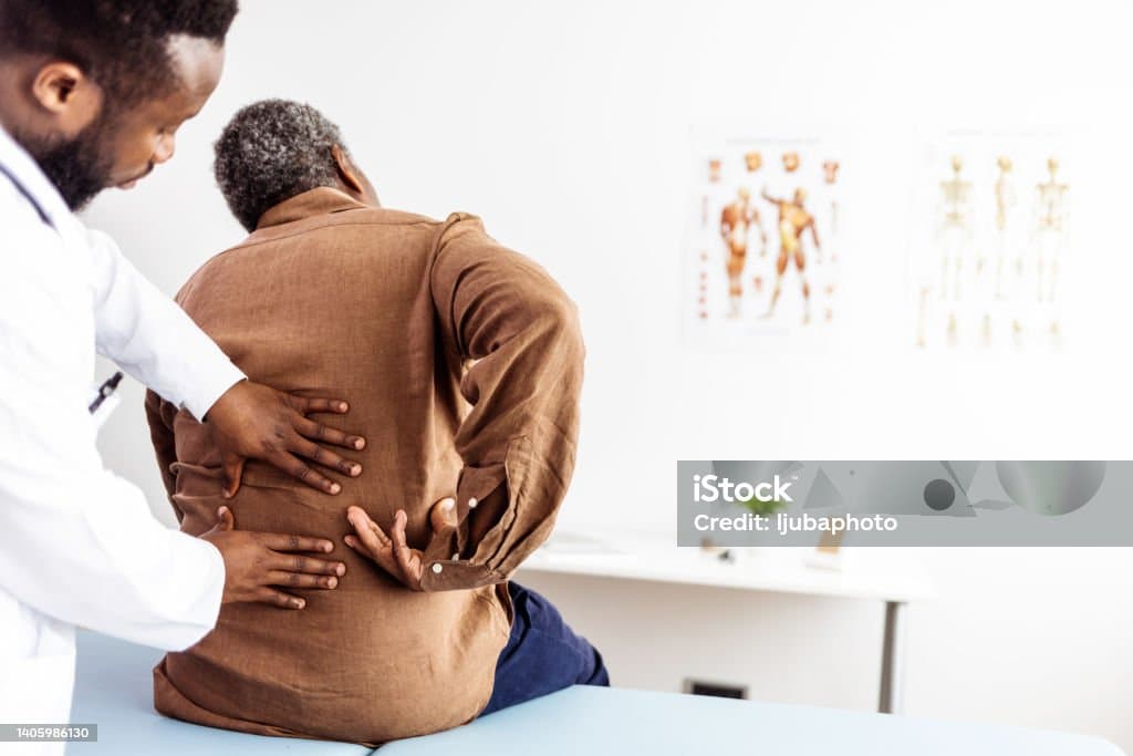 Chiropractor treating a patient with sciatica pain at Advanced Wellness Chiropractic in Bridgeton MO